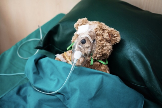 A teddy bear hospitalised and put on oxygen support.
