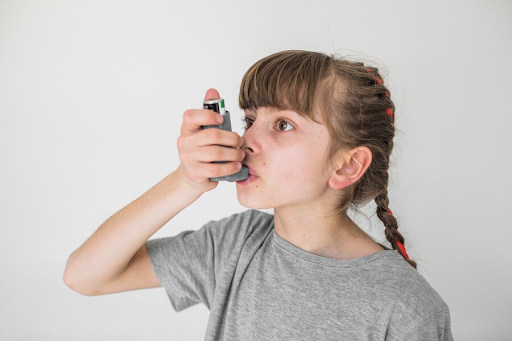 Children using inhaler due to asthma symptoms