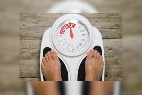 Weighing Scale Showing with a person standing on it